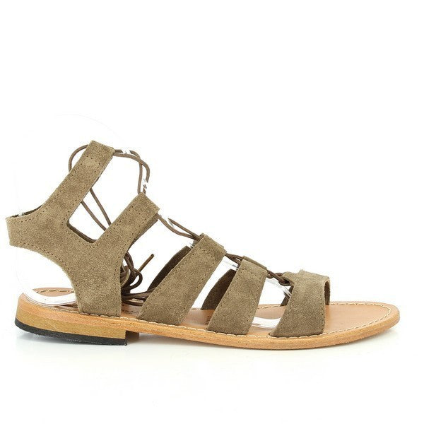 
The photo showcases the Antichi Romani 348 Taupe Gladiator Sandals, elegantly displayed on a neutral backdrop. The sandals feature a sleek, soft taupe leather upper with intricate, slender straps that crisscross up the foot, highlighting the gladiator style. The sandals have a subtle 2 cm heel platform for a slight lift, with a round toe shape providing a balanced, classic silhouette. The rich leather texture and expert craftsmanship are visible in the fine stitching and detailing. 