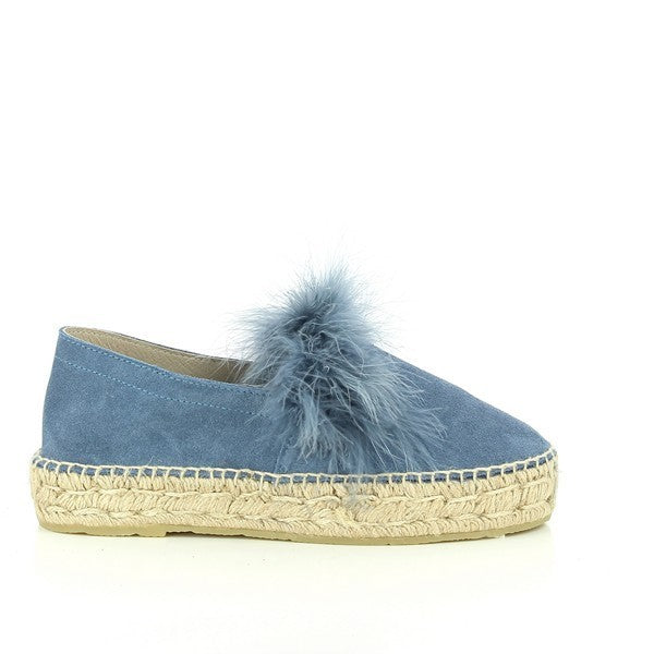 The Calzanor 2045 Marabu Blue Jeans Espadrilles are elegantly displayed, showcasing their eye-catching blue leather upper adorned with decorative front feathers. The rich color complements the feather accents, adding a playful yet sophisticated touch.