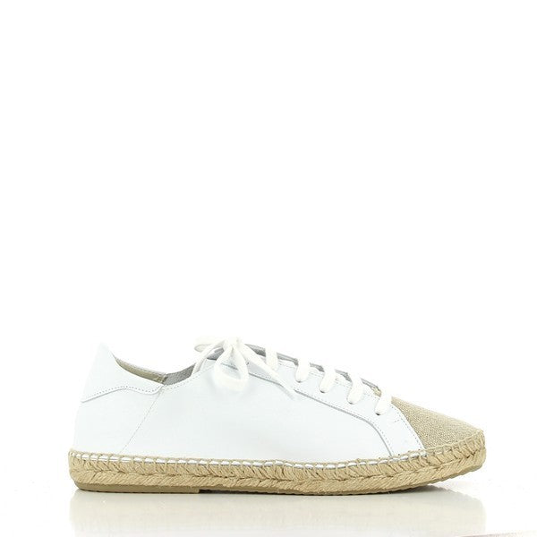 The Calzanor 2086 White Lace-Up Espadrilles are elegantly displayed against a neutral background, showcasing their sleek design and premium materials. The soft white leather upper features delicate lace-up detailing, adding a touch of sophistication. The round toe shape enhances the classic espadrille silhouette, while the 2 cm synthetic sole provides both style and comfort. The natural jute detailing around the sole highlights the eco-friendly craftsmanship of these espadrilles.