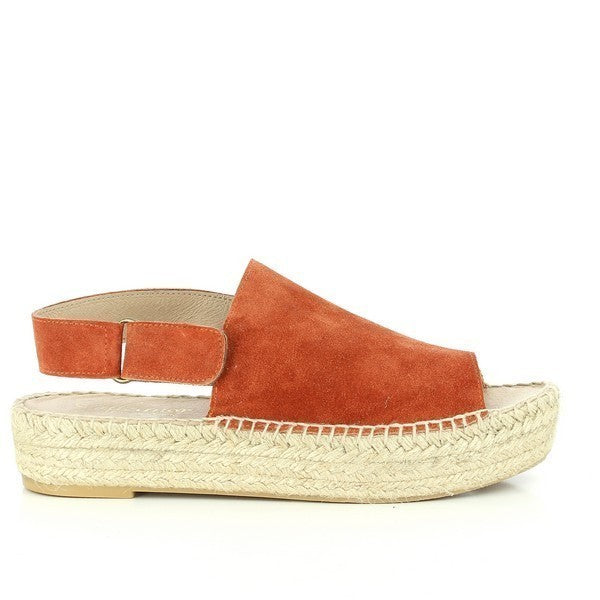 The Calzanor 4511PO Orange Slingback Espadrilles feature a vibrant orange leather upper that instantly catches the eye. The open front design adds a touch of modern flair, making them perfect for warm-weather outings. With a soft leather lining for comfort, these espadrilles are crafted with a 3cm platform heel that provides a subtle lift. The classic round toe shape complements the stylish silhouette, showcasing Calzanor's commitment to quality and craftsmanship. 