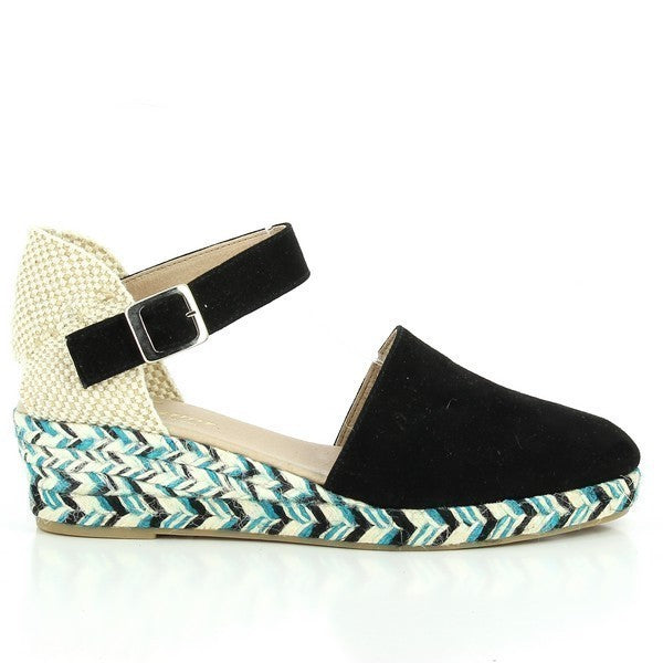 The Calzanor 8880 Black Espadrilles are elegantly designed with a sleek black leather upper that exudes sophistication. The shoes feature a rounded toe and a subtle 3 cm heel, providing a comfortable lift while maintaining a classic espadrille silhouette. The interior is lined with soft leather for added comfort, while the jute sole offers a natural and eco-friendly touch. The overall look is versatile, making them perfect for both casual and semi-formal occasions. 