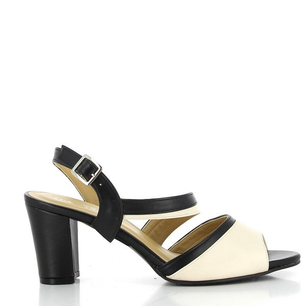 The side view of the Dalessi Daylong Black & Cream Slingback Heels highlights the sleek leather upper with its elegant black and cream color contrast. The 7 cm heel adds height while maintaining balance and comfort.