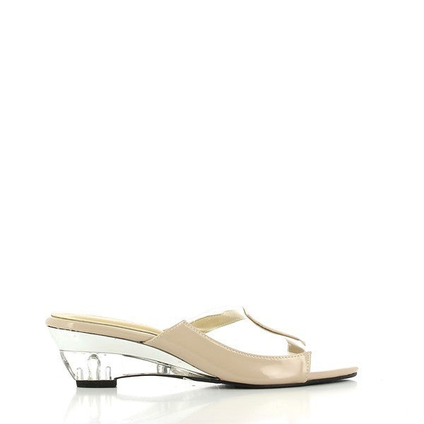The side view of the Dalessi Detour Nude Slides highlights the sleek nude leather upper, complemented by transparent material accents. The transparent 5.5 cm heel adds a sophisticated, modern touch, perfectly balancing style and functionality.