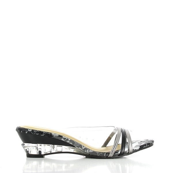 The side view of the Dalessi Diverge Pewter & Black Slides showcases the sleek, transparent upper and heel. The three black and pewter straps add a striking visual contrast, creating a chic and contemporary look. The clean lines and minimalistic design highlight the sophisticated style.