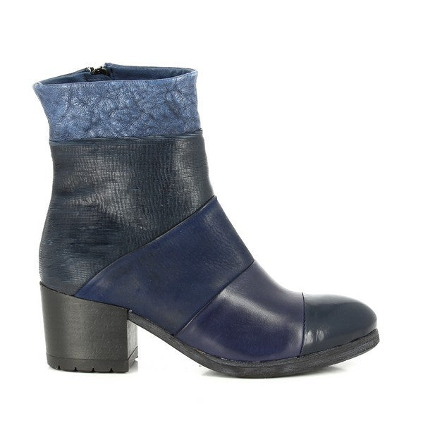 A sleek, side view of the Felmini 9862 navy ankle boots, highlighting the smooth leather upper and clean silhouette. The rich navy color, with subtle tonal variations, is evident, adding depth to the design. The 6cm heel provides an elegant height, complementing the rounded toe.
