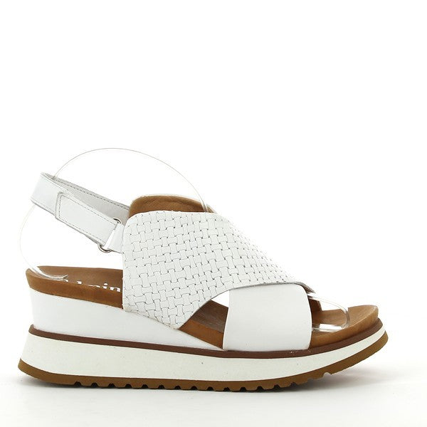 A close-up view of the Felmini C312 White Slingback Sandal showcasing the elegant cross-straps across the foot, with the smooth leather upper and clean, minimalist design.