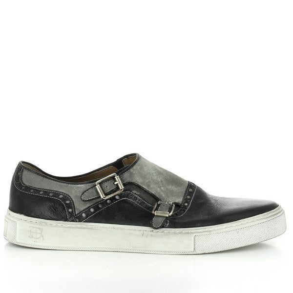 The Forte S17-3240 Black Double Monk Shoes feature a sleek, elegant profile with two polished leather straps on the side. The smooth black leather upper exudes a classic, refined look, perfect for both formal and smart-casual occasions.