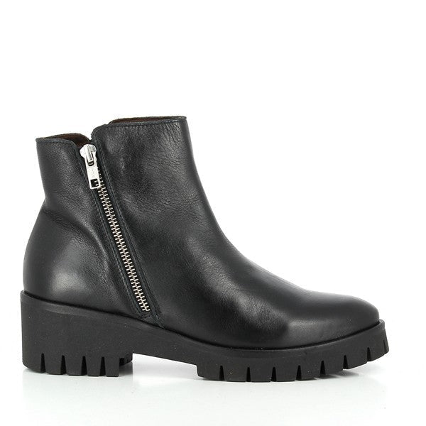 A sleek black ankle boot with a smooth leather upper, featuring a streamlined silhouette and a sturdy 5cm heel for a balanced, elegant look.