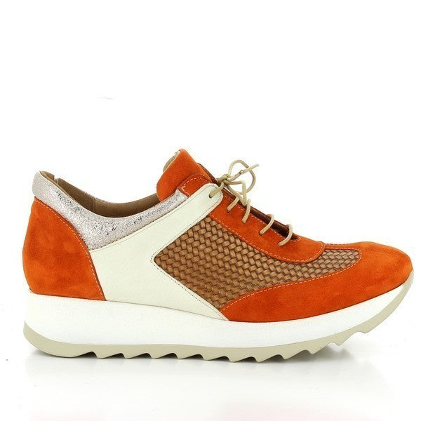 A stylish sneaker featuring a vibrant orange and white leather upper, highlighting the bold contrast and sleek design. The smooth finish adds a modern touch.