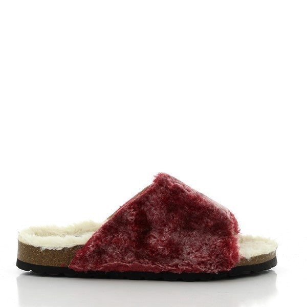 In the image, Plakton's 103036 Burgundy Fur Slides take center stage, exuding elegance and comfort. Handcrafted in Spain, these slides feature a plush burgundy fur upper complemented by a leather lining for premium comfort. The 2.5cm platform heel adds a subtle lift, while the round toe shape ensures ample room for your toes. Step into luxury with Plakton's Sandals and elevate your style effortlessly.