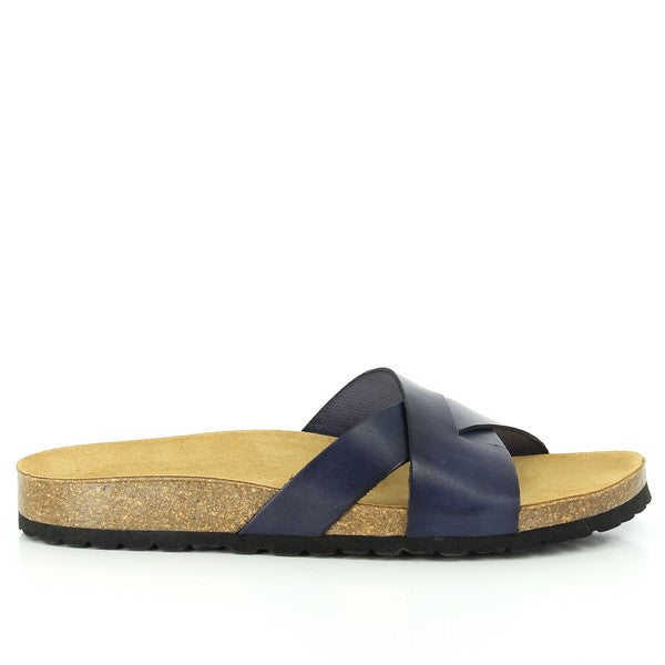 In this captivating photo, Plakton's 105317 Navy Slides take center stage, showcasing their timeless elegance and superior craftsmanship. Crafted with a leather upper and cork sole, these sandals offer both style and comfort. The wide fit ensures a perfect fit for every foot, while the classic navy color adds a touch of sophistication. Step into luxury with Plakton's iconic slides.