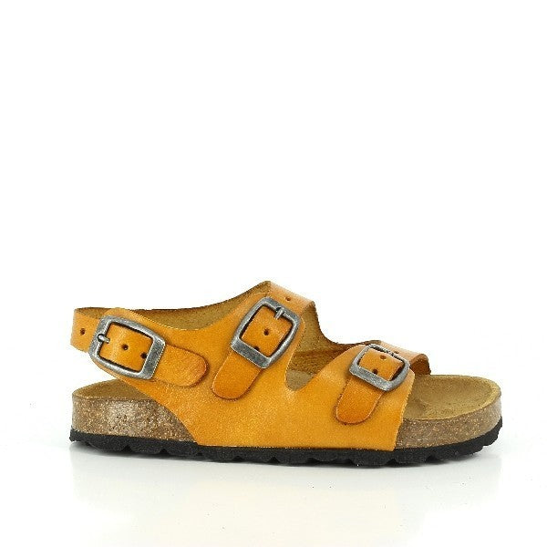 A close-up of the Plakton 110046 Slingback Kids Sandal in tan. The sandal features a soft leather upper with a natural tan hue, complemented by a matching leather lining. The open toe design and adjustable buckle fastening straps ensure a secure and comfortable fit. The cork sole with synthetic grip provides durability and a touch of rustic charm, making it perfect for any casual outing.