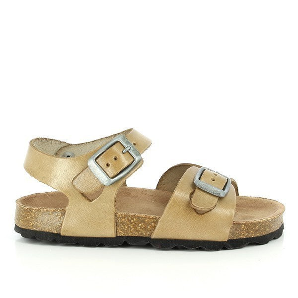 A close-up shot of a beige kids sandal. The sandal features a high-quality leather upper with a soft, smooth texture. The synthetic sole is designed with a slight heel platform of 2cm, offering a subtle lift. The sandal's adjustable strap and ankle strap ensure a secure fit. The round toe shape provides ample space for comfort. The natural cork footbed can be seen, highlighting the eco-friendly design. Made in Spain, the sandal showcases meticulous craftsmanship.