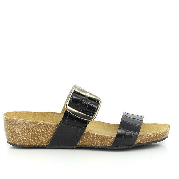 A detailed side view showcasing Plakton's 243004 Black Low Heel Wedges, highlighting the smooth black leather upper, golden buckle detail on the adjustable strap, and the modest heel platform ranging from 1.5cm to 4cm. This angle emphasizes the sandals' elegant design and comfortable height.