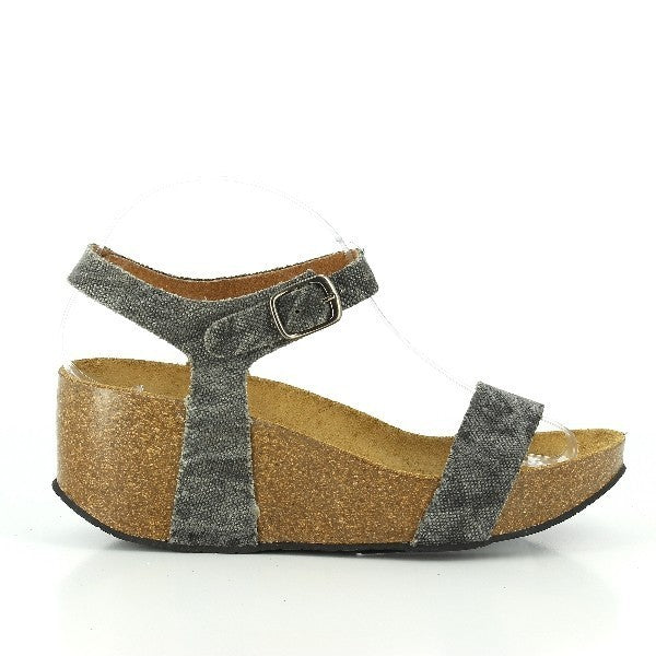 Capture the sleek silhouette of Plakton's 273023 Jeans Wedges, highlighting the premium leather upper and eco-friendly cork sole. Perfect for enhancing your style with comfort and sustainability.