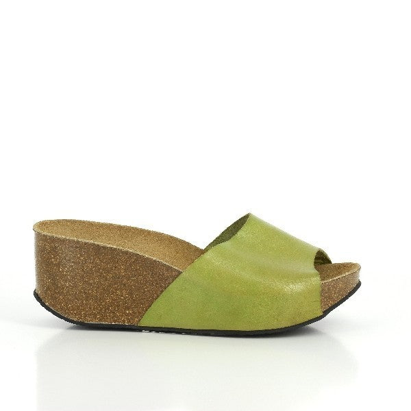A stylish photo featuring Plakton's 273036 Pistachio Wedges from their Women's Collection. Handcrafted in Spain from premium leather, these wedges showcase a soft upper with an adjustable ankle strap and a cork sole. Perfect for elevating casual outfits with comfort and elegance.