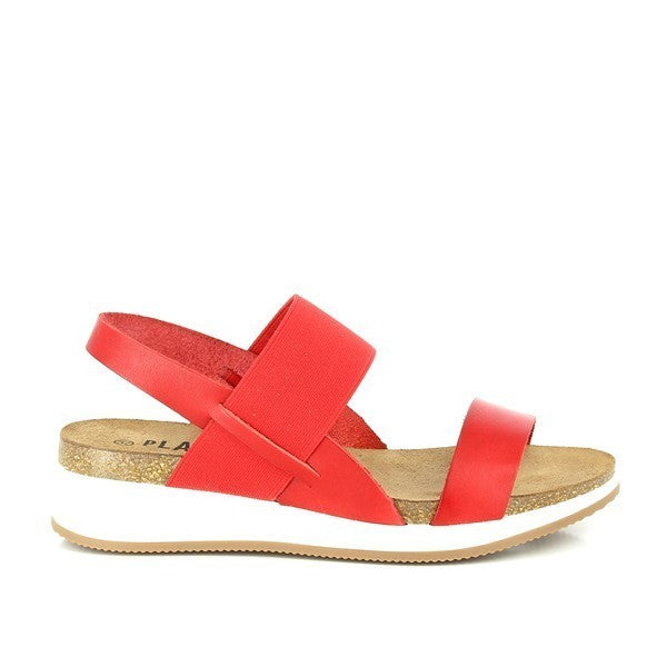 A close-up of Plakton's 395335 Red Cross-Strap Slingback Sandals in vibrant red, showcasing their handcrafted premium leather upper and cork sole. The sandals feature elastic cross-straps and a secure slingback design, offering both style and comfort. Ideal for eco-conscious fashion enthusiasts looking for durability and elegance.